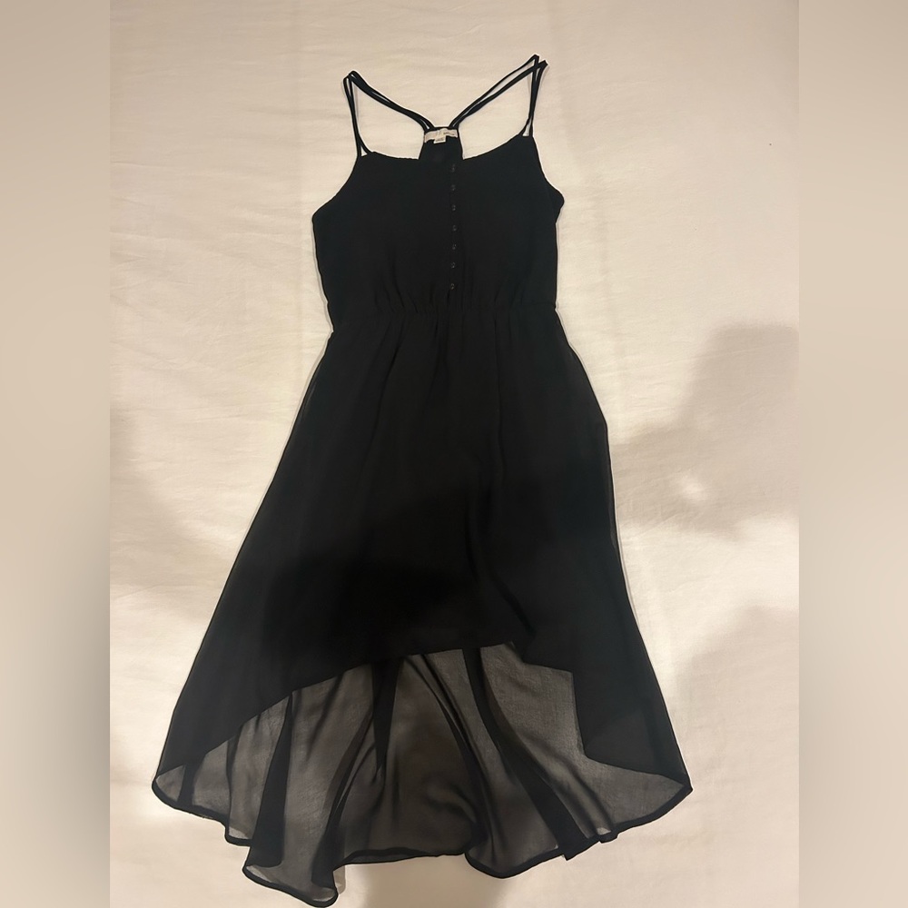 Black mini dress with mini trail.